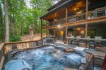 Amazing backyard with hot tub, fire pit, multiple decks, and yard games